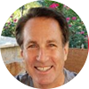 This image shows Andrew Baer, an advisor and senior executive with extensive experience in the telecommunications and IT industry.